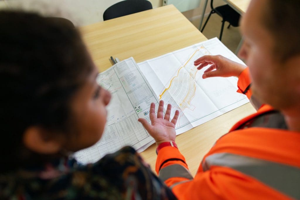 Surveyor looking at map